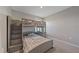 bedroom with a full-size bed and built-in storage at 5120 Vecchio Ct, Bradenton, FL 34211