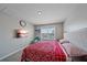 Comfortable bedroom featuring a king-size bed and lovely window view at 5120 Vecchio Ct, Bradenton, FL 34211