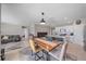 Open concept dining area with wood table and kitchen views at 5120 Vecchio Ct, Bradenton, FL 34211