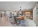 Bright dining area with wood table and access to kitchen at 5120 Vecchio Ct, Bradenton, FL 34211