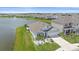 Aerial view of a house by the lake in a community at 5120 Vecchio Ct, Bradenton, FL 34211