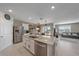 Modern kitchen with stainless steel appliances and granite countertops at 5120 Vecchio Ct, Bradenton, FL 34211