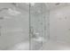 Modern bathroom with a large glass shower and white tile at 111 S Pineapple Ave # 1021, Sarasota, FL 34236