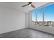 Spacious bedroom with large windows, wood-look floors, and a ceiling fan at 111 S Pineapple Ave # 1021, Sarasota, FL 34236