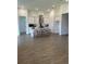 Large kitchen with ample countertop space, island seating, stainless hood, and modern hardwood floors at 11709 Capstan Pl, Parrish, FL 34219