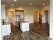 Bright kitchen features a large island with granite countertops and stainless steel appliances at 11722 Capstan Pl, Parrish, FL 34219