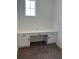 Bright office space features plush carpet and a built-in white desk with storage at 11722 Capstan Pl, Parrish, FL 34219