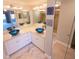 Modern bathroom boasts dual sinks, blue glass bowls, and marble countertops at 5027 Kestral Park Dr # 64, Sarasota, FL 34231