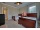 Cozy bedroom with two beds and a shared nightstand, featuring a ceiling fan and a bright window at 5120 Tidewater Preserve Blvd, Bradenton, FL 34208