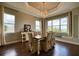 Elegant dining room with large windows, custom ceiling design, and neutral decor for sophisticated meals at 5120 Tidewater Preserve Blvd, Bradenton, FL 34208