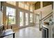 Bright and airy foyer with double doors, tiled floors, and staircase, creating a welcoming entrance at 5120 Tidewater Preserve Blvd, Bradenton, FL 34208
