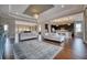 Bright, open-concept living room and kitchen with hardwood floors and stylish furnishings for seamless entertaining at 5120 Tidewater Preserve Blvd, Bradenton, FL 34208