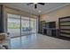 Spacious living room with a view of the screened lanai, perfect for relaxing and entertaining at 5120 Tidewater Preserve Blvd, Bradenton, FL 34208
