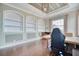 Bright office with a large window, recessed shelving, and a stylish desk for productive work at 5120 Tidewater Preserve Blvd, Bradenton, FL 34208