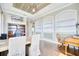 This home office is complete with hardwood floors, built-in shelving, and a stylish desk at 5120 Tidewater Preserve Blvd, Bradenton, FL 34208