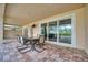 Brick-paved patio with a dining table for six, featuring an outdoor view to the pool and palm trees at 5120 Tidewater Preserve Blvd, Bradenton, FL 34208