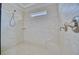 Tiled walk-in shower with sleek fixtures and a built-in bench for a spa-like experience at 5120 Tidewater Preserve Blvd, Bradenton, FL 34208