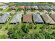 Aerial view of homes with lake, and trees in a beautiful community at 7572 Viola Loop, Lakewood Ranch, FL 34202