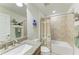 Bathroom featuring a granite countertop vanity, toilet, tub, and shower combo at 7572 Viola Loop, Lakewood Ranch, FL 34202