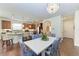 Light and airy kitchen showcases bar stool seating and granite countertops at 7572 Viola Loop, Lakewood Ranch, FL 34202