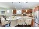 Spacious kitchen with a center island, stainless steel appliances, and stylish pendant lights at 7572 Viola Loop, Lakewood Ranch, FL 34202
