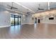 Spacious meeting room with wood floors, fan lighting and access to the outside at 7572 Viola Loop, Lakewood Ranch, FL 34202