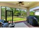 Screened-in porch with grill, pavers, and a view of the fenced-in backyard at 7572 Viola Loop, Lakewood Ranch, FL 34202