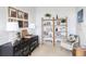Charming home office with built-in shelving and comfortable seating at 9973 Key Haven Rd, Seminole, FL 33777