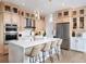 Modern kitchen with light wood cabinets, stainless steel appliances, and an island at 9973 Key Haven Rd, Seminole, FL 33777