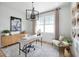 Spacious home office with built-in wooden cabinets and a large window at 9975 Key Haven Rd, Seminole, FL 33777