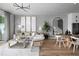 Bright and airy living room featuring a neutral color palette and ample natural light at 9975 Key Haven Rd, Seminole, FL 33777