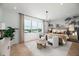 Large bedroom with a king-size bed, a tropical-themed accent wall, and plenty of natural light at 9975 Key Haven Rd, Seminole, FL 33777