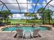 Relaxing screened pool and spa with golf course view at 4515 Terrazza Ct, Lakewood Ranch, FL 34211