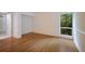 Bright bedroom with hardwood floors and window view at 1542 Oak St # 6, Sarasota, FL 34236