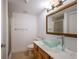 Bathroom with glass sink and wood vanity at 1542 Oak St # 6, Sarasota, FL 34236