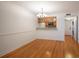 Bright dining area with hardwood floors and kitchen access at 1542 Oak St # 6, Sarasota, FL 34236