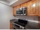 Kitchen with stainless steel appliances and wood cabinets at 1542 Oak St # 6, Sarasota, FL 34236