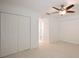 Bedroom with double closets and ceiling fan at 1542 Oak St # 6, Sarasota, FL 34236