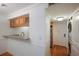 Granite countertop kitchen with wood cabinets and a breakfast bar at 1542 Oak St # 6, Sarasota, FL 34236