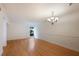 Bright dining room featuring hardwood floors and chandelier at 1542 Oak St # 6, Sarasota, FL 34236