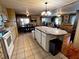 Open kitchen with granite countertop and island at 606 Cyprus Ct, Bradenton, FL 34207