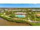 Aerial view of community with pool, clubhouse, and playground at 5120 Tidewater Preserve Blvd, Bradenton, FL 34208