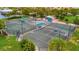 Community tennis courts with seating areas at 5120 Tidewater Preserve Blvd, Bradenton, FL 34208