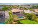 Aerial view showcasing a house with a private pool and screened enclosure at 5120 Tidewater Preserve Blvd, Bradenton, FL 34208