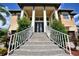 Grand entrance to a two-story house with brick stairs and railings at 5120 Tidewater Preserve Blvd, Bradenton, FL 34208