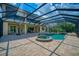Screened pool and spa with basketball hoop nearby at 5120 Tidewater Preserve Blvd, Bradenton, FL 34208