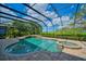 Enjoy this luxurious pool and spa with screened enclosure at 5120 Tidewater Preserve Blvd, Bradenton, FL 34208