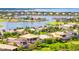 Aerial view of a waterfront community with luxury homes and lush landscaping at 5120 Tidewater Preserve Blvd, Bradenton, FL 34208