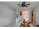 Bright office space with built-in shelving and a ceiling fan at 3447 Tallywood Ln # 7143, Sarasota, FL 34237