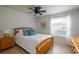 Cozy bedroom with a wooden bed frame, nightstand, and plenty of natural light at 3447 Tallywood Ln # 7143, Sarasota, FL 34237